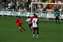 Lee Noble forces the Charlton player to boot it into touch (Large).jpg