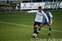 19 James (White) is closely shadowed by the Gills player.jpg