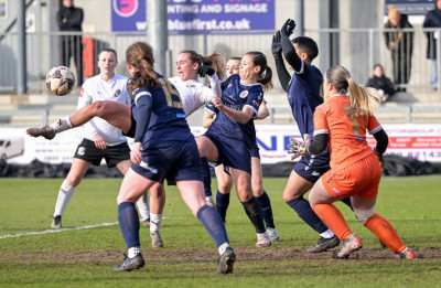 2024-2025 v Bromley KWC qtr-fin Xayla challenges goalmouth scramble.jpg