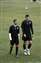 3 The strike pair walk off together after pre-match warm-up.jpg