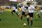 11 Carl gets the ball as Elliot and Charlie look on.jpg